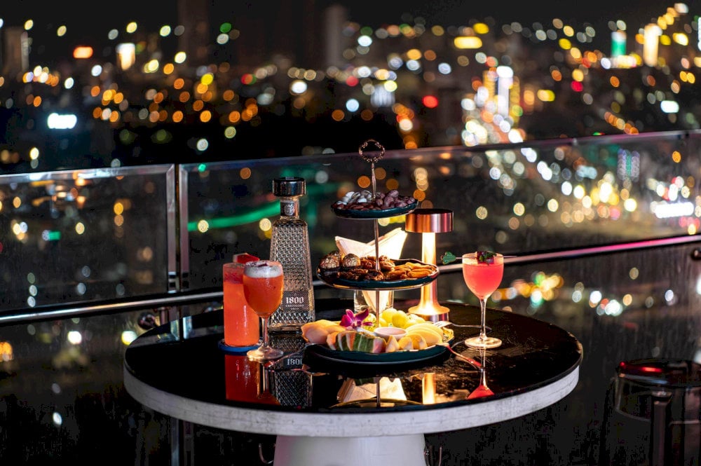 Savor signature cocktails crafted to perfection while enjoying the breathtaking views at Sky36